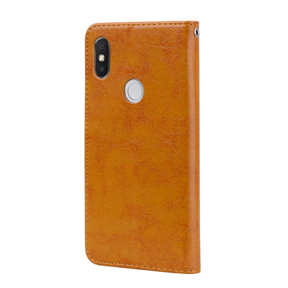 Brown oil-wax textured leather flip cover with camera cutout and speaker holes