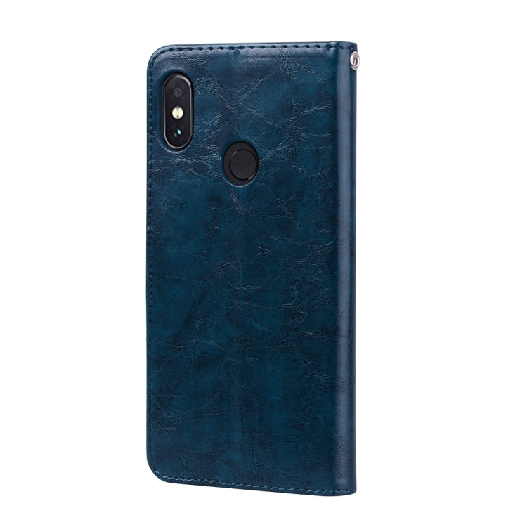 Blue leather phone case with camera cutout and slim back cover