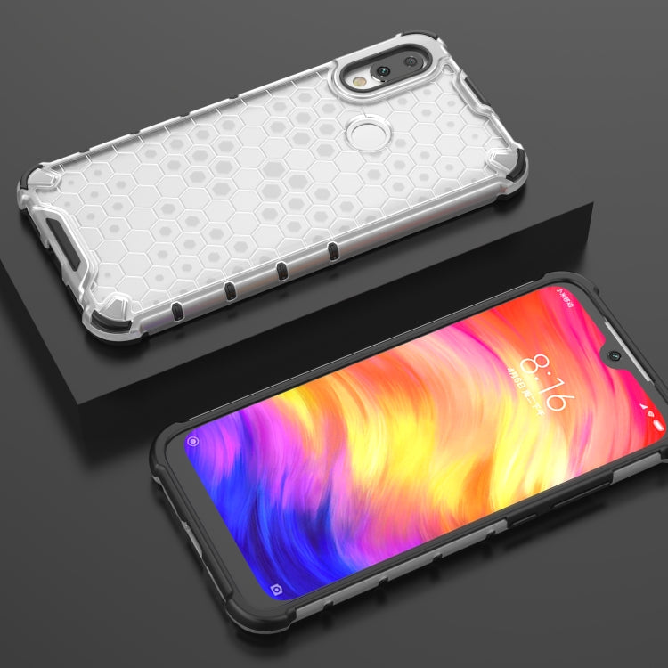 Clear honeycomb shockproof case with side button cutouts, phone front visible