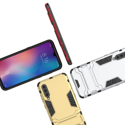 Rugged phone case display showing red, yellow, and gray back shells for Xiaomi Mi 9