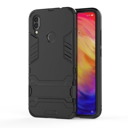 Black shockproof phone case with textured armor edges and camera openings