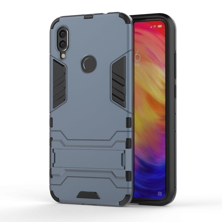 Navy blue shockproof phone case with armor-style grips and side cutouts