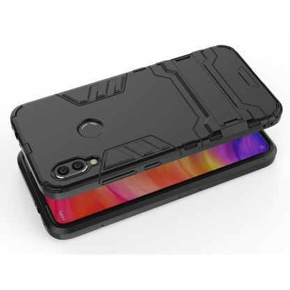Black shockproof phone case with rugged armor design and port cutouts