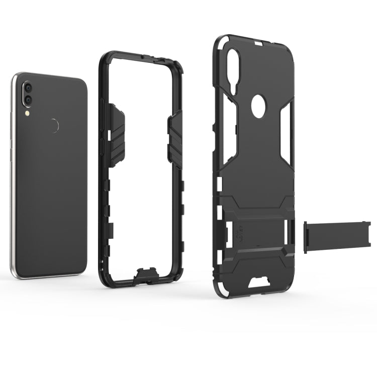 Black shockproof phone case with stand/strap piece, front and back open views