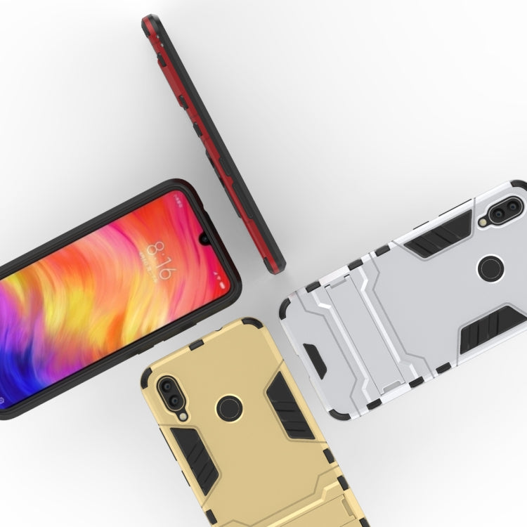Assorted shockproof phone cases with armor design, showing white/gray and beige versions
