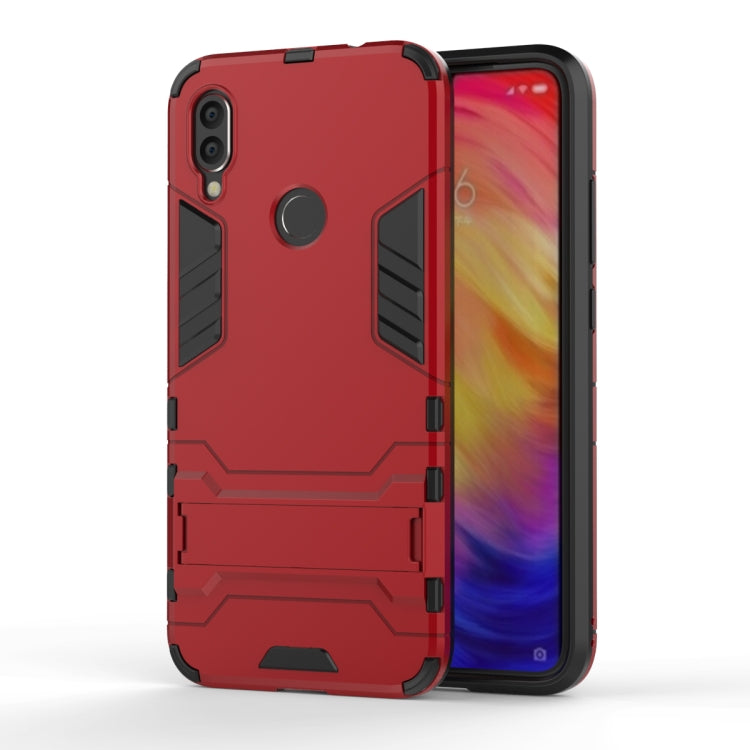 Red shockproof phone case with rugged armor pattern and dual-camera cutouts