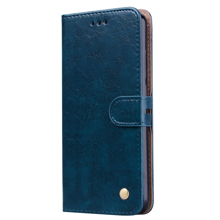 Blue vertical flip leather phone case with fold-over strap and camera cutout