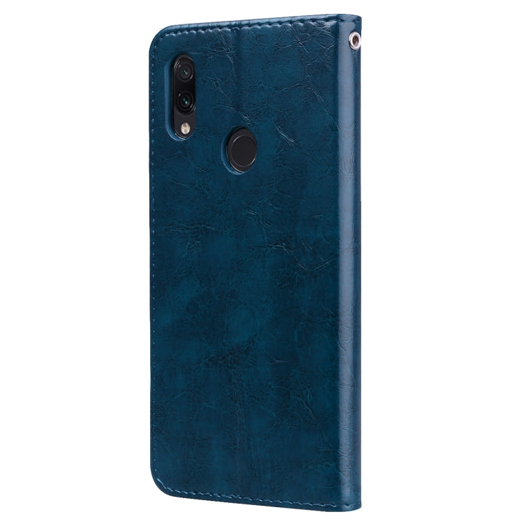 Blue leather phone case with back camera openings and cutout for speaker