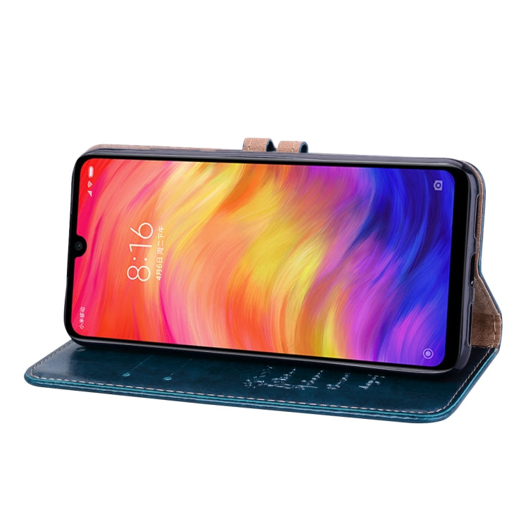 Blue flip leather wallet case holding a phone with screen facing outward