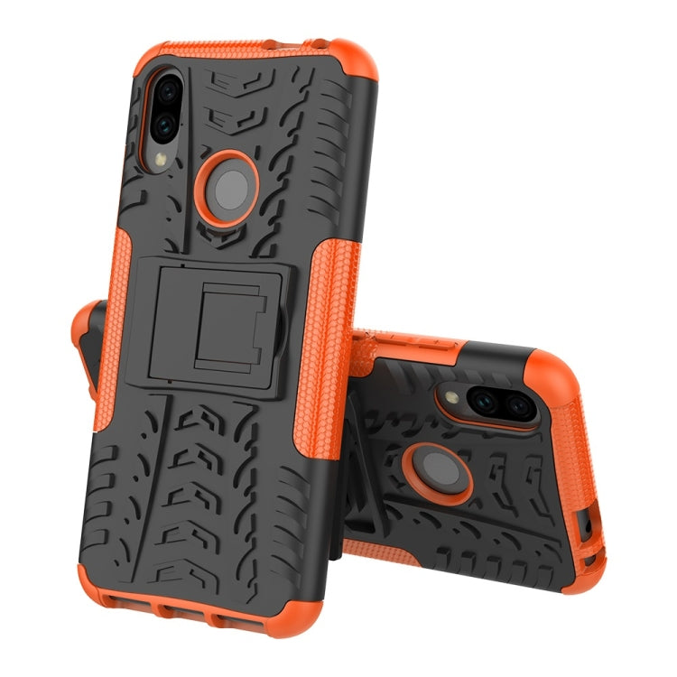 Orange and black tire-texture shockproof phone case with ring holder and camera openings