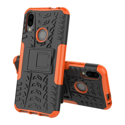 Orange and black tire-texture shockproof phone case with ring holder and camera openings