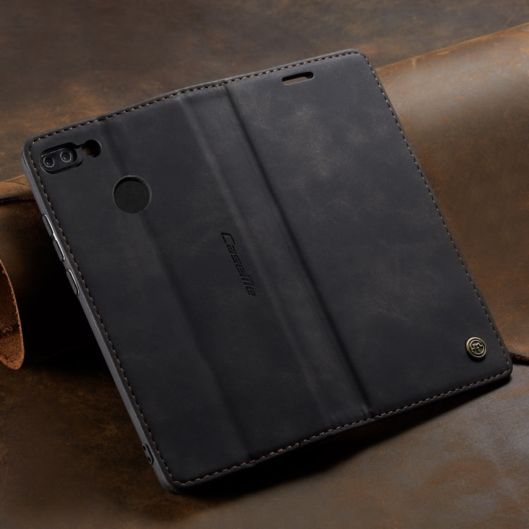 Dark leather flip wallet phone case with stitched edges and circular cutout