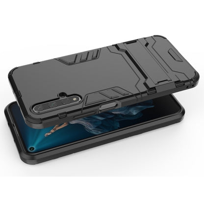 Black rugged shockproof phone case with holder stand, top view with cutouts
