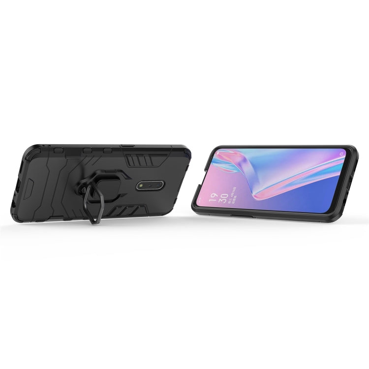 Black rugged phone case with magnetic ring holder; phone resting in case