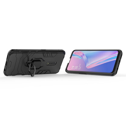 Black rugged phone case with magnetic ring holder; phone resting in case