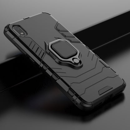 Black rugged phone case with magnetic ring holder, angled view