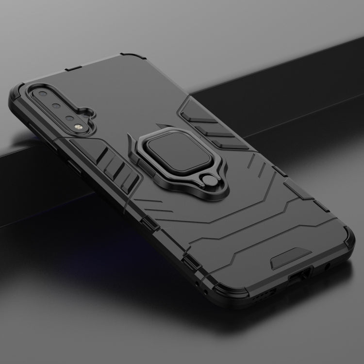 Black shockproof phone case with magnetic ring holder, textured armor detail close-up