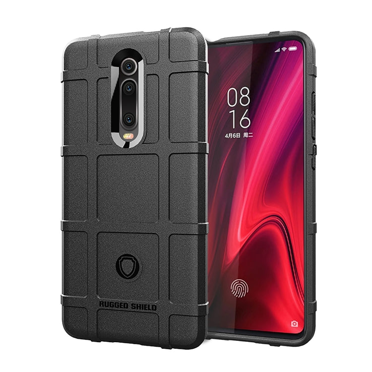 Rugged silicone phone case with full coverage, raised edges, and camera cutouts in black