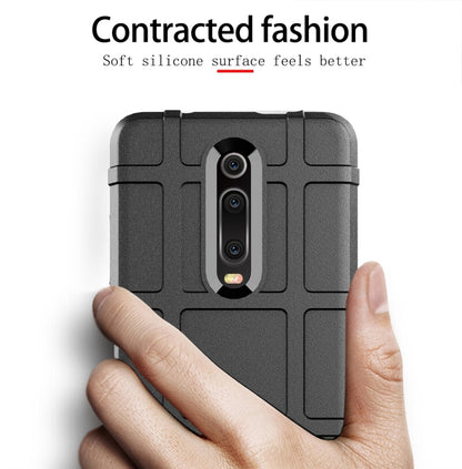 Black silicone phone case with textured surface and precise cutouts for camera