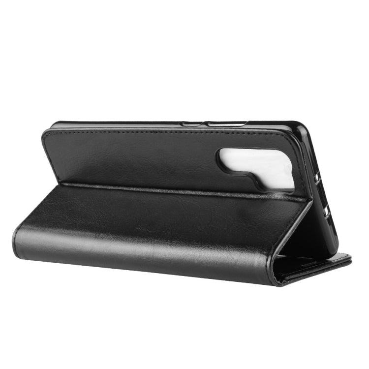 Black leather folio flip phone case with stand and side button cutouts