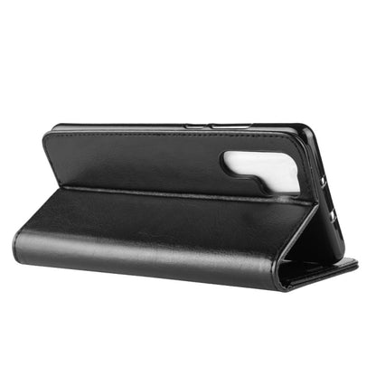 Black leather folio flip phone case with stand and side button cutouts