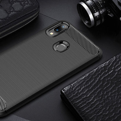 Black carbon fiber textured TPU case with circular ring and dual camera cutouts